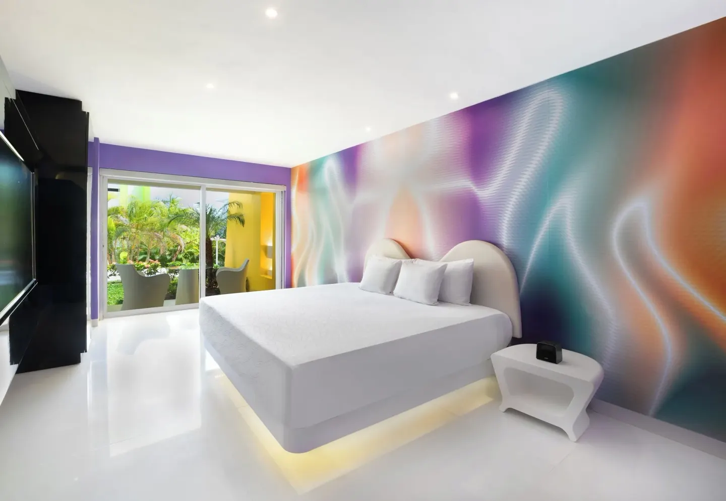 Trendy Garden View Playful Experience room with king bed at Temptation at The Tower Cancún.