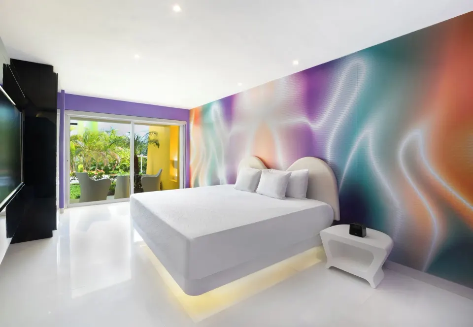 Trendy Garden View Playful Experience room with king bed at Temptation at The Tower Cancún.