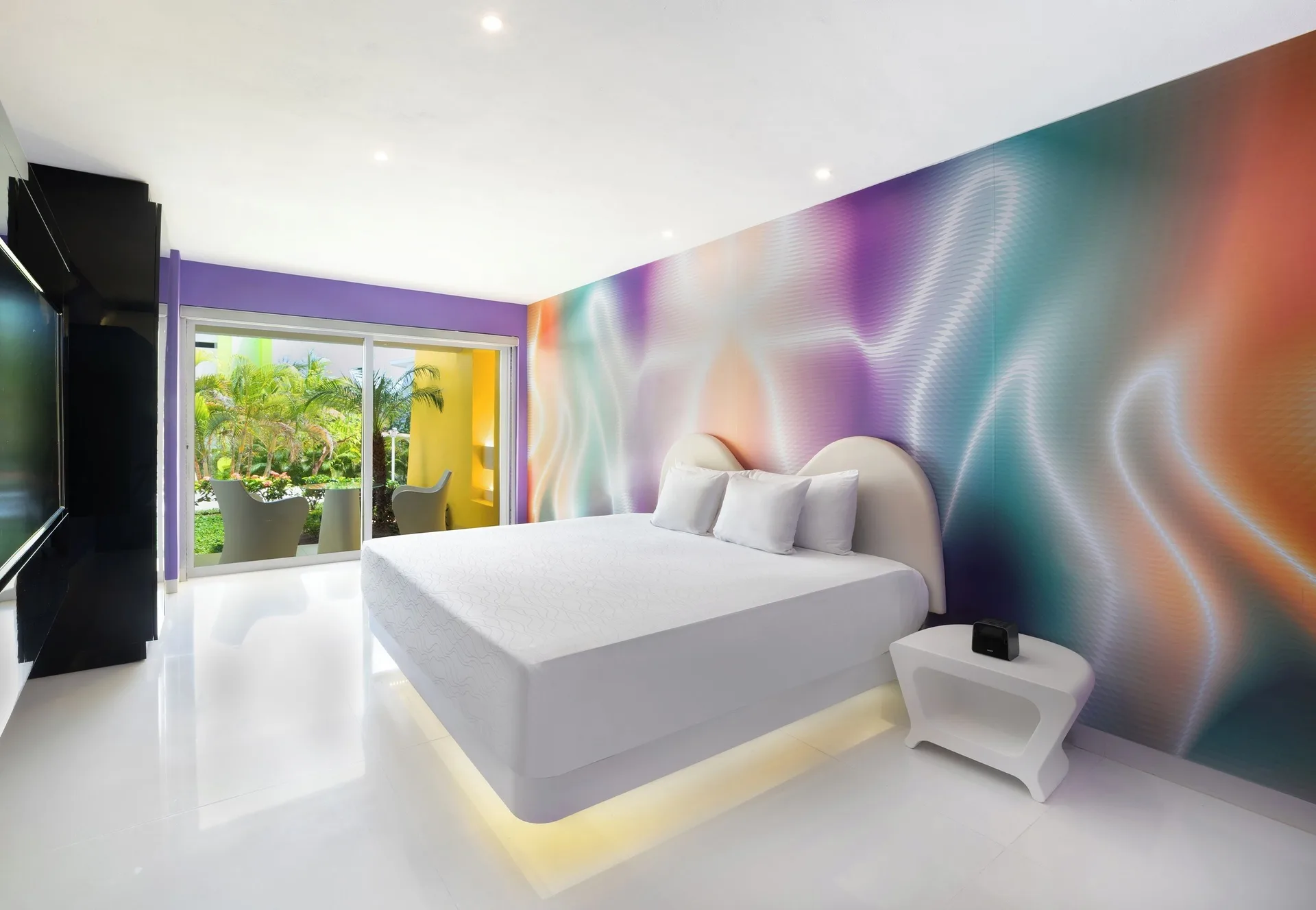 Trendy Garden View Playful Experience room with king bed at Temptation at The Tower Cancún.