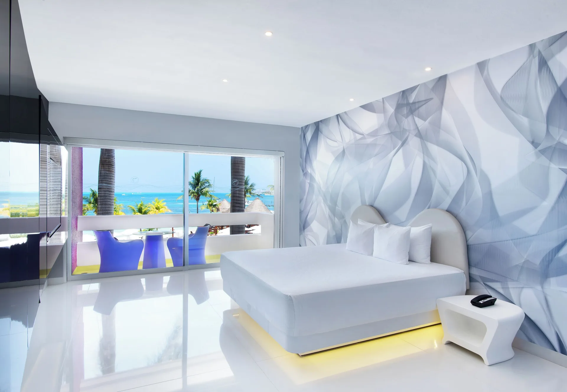 Trendy Ocean View Room king bed and balcony at Temptation at The Tower Cancún.
