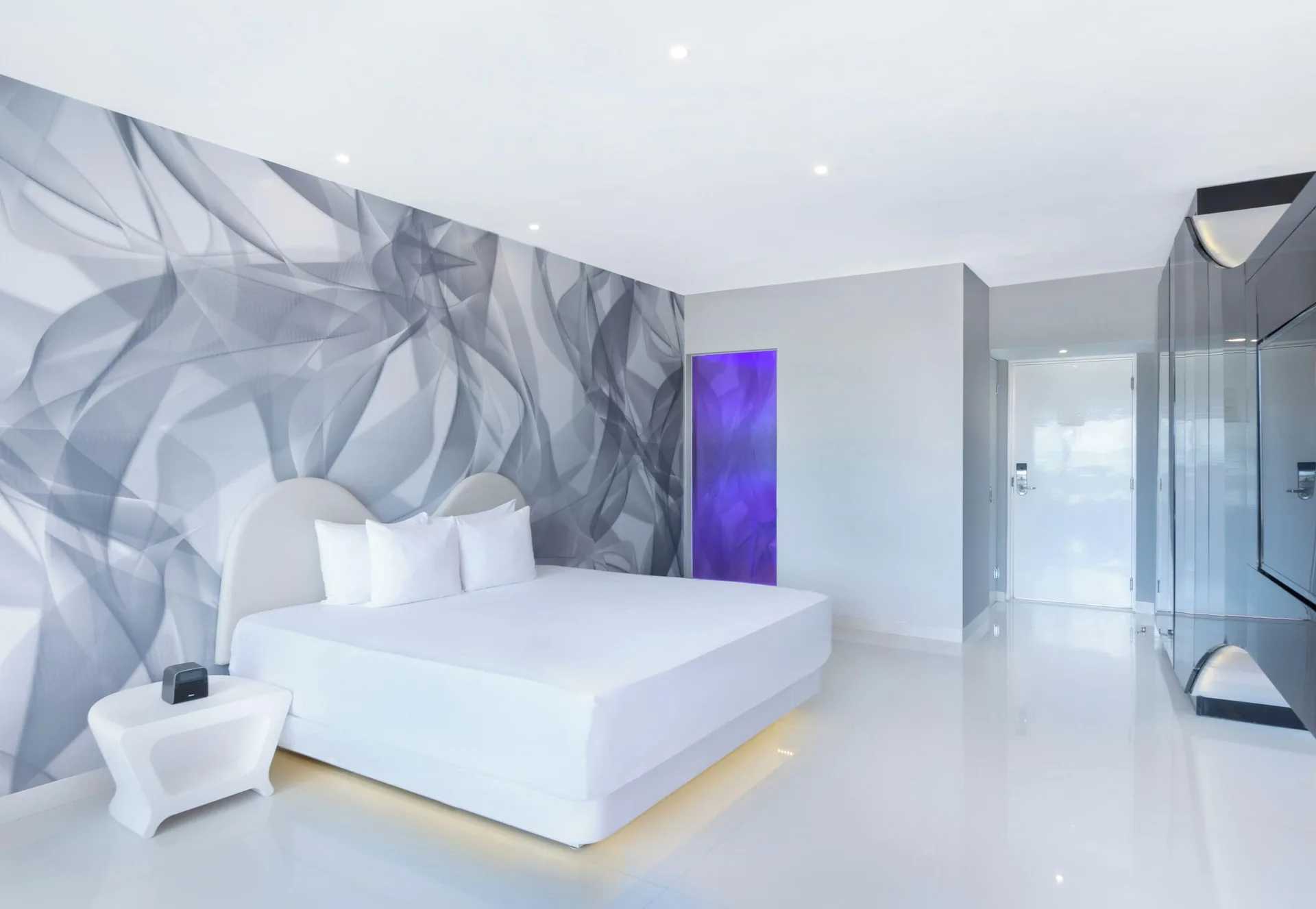 Trendy Ocean View Room king bed and entry area at Temptation at The Tower Cancún.