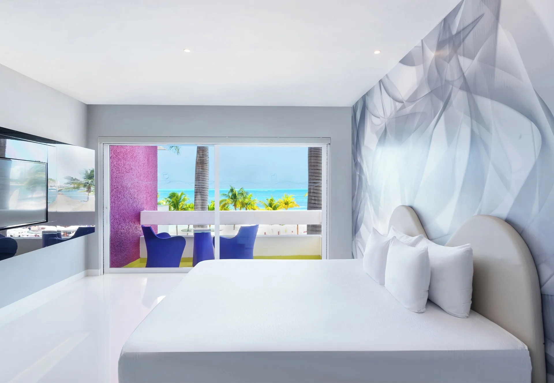 Trendy Ocean View Room king bed with balcony view at Temptation at The Tower Cancún.