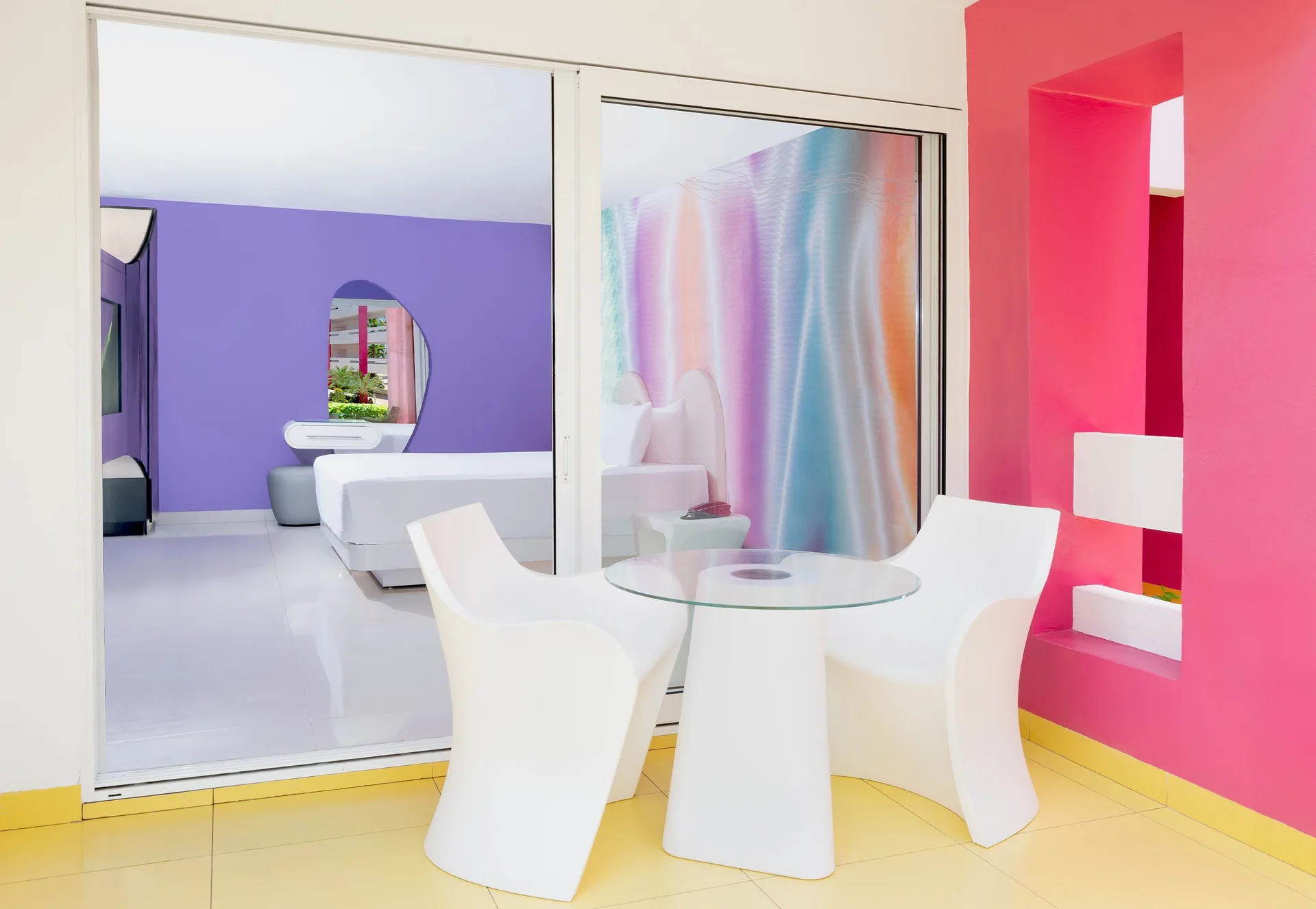 Trendy Room terrace with white chairs and a view into the room at Temptation at The Tower Cancún.