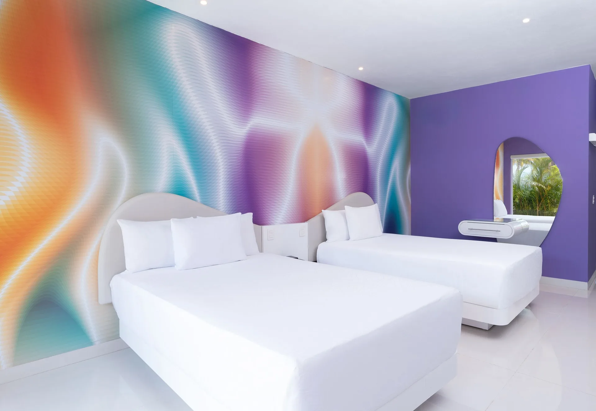 Trendy Room with two white beds and a round mirror at Temptation at The Tower Cancún.
