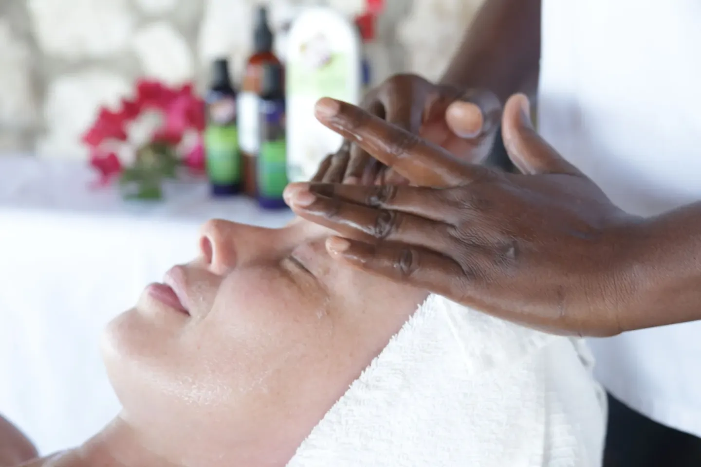 Close-up of a forehead massage during a facial at Tensing Pen Hotel.
