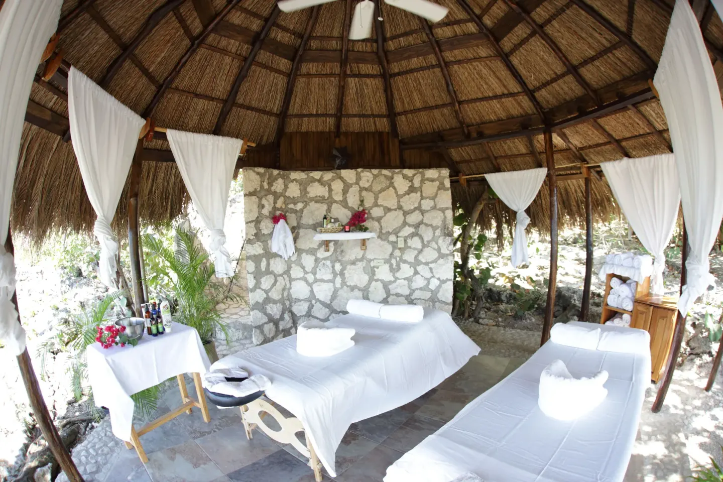 Open-air spa treatment pavilion with two massage tables at Tensing Pen Hotel.