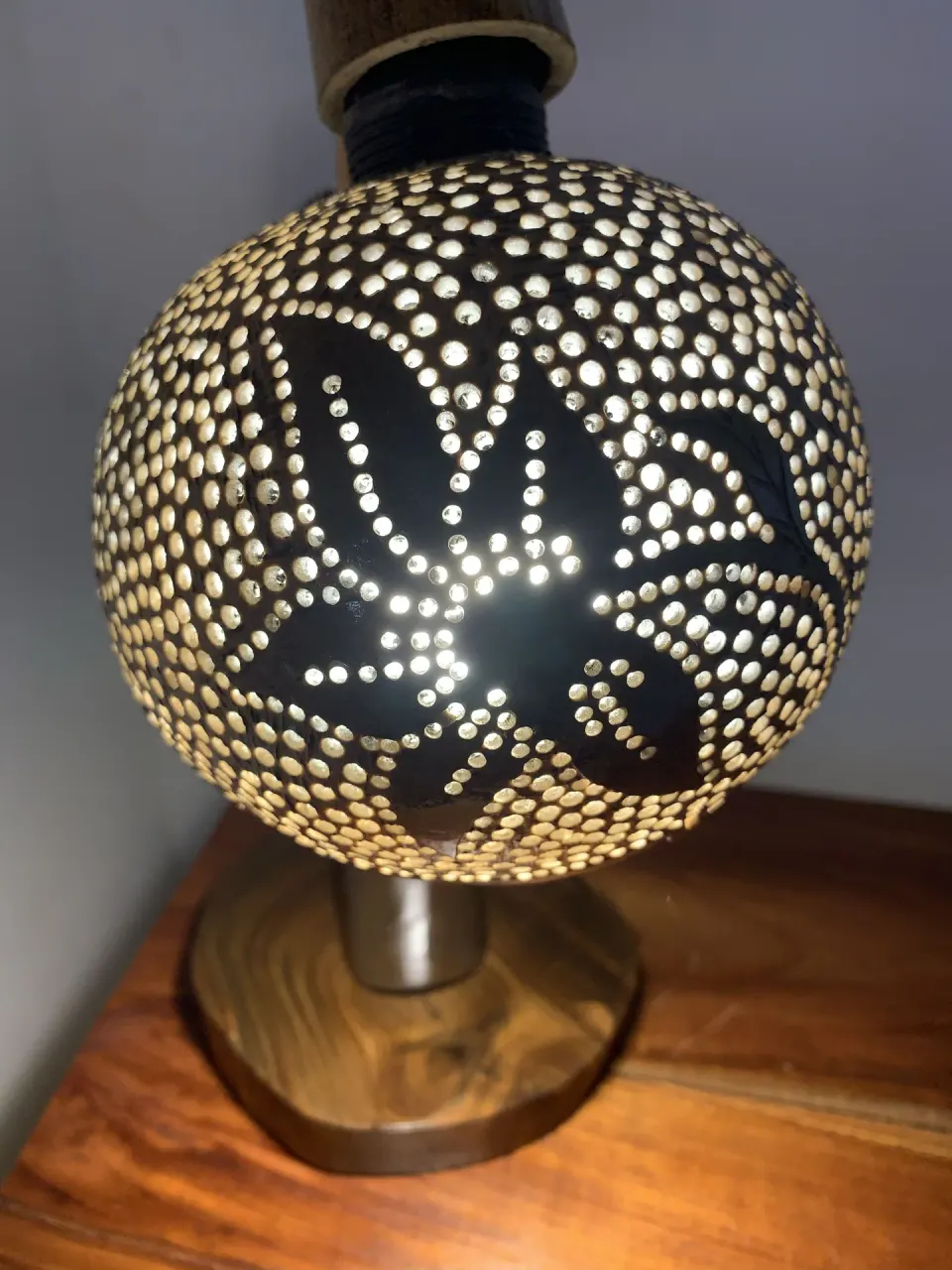 Close-up of a patterned bedside lamp in a Deluxe Room at Tensing Pen Hotel.