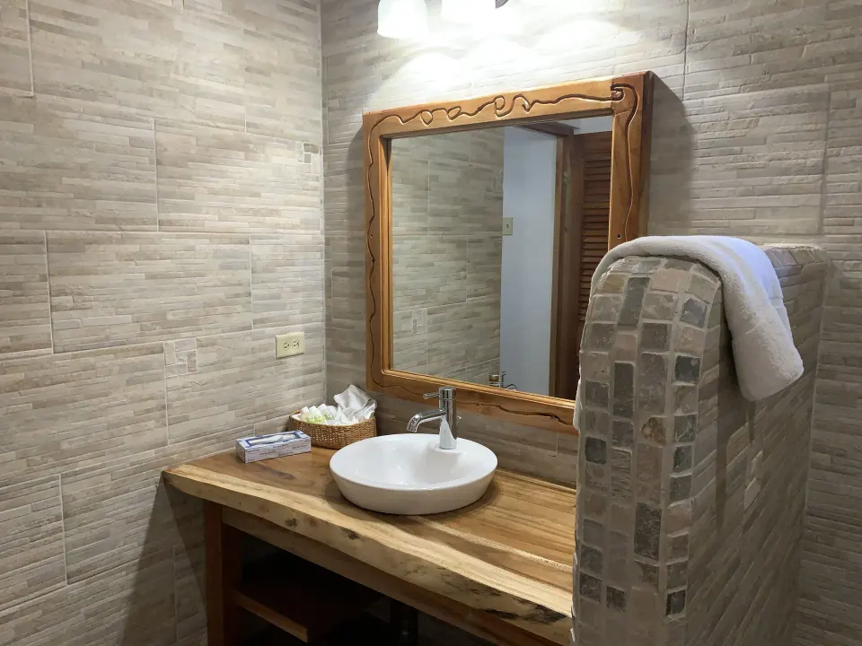 Superior Garden View bathroom vanity and mirror at Tensing Pen Hotel.