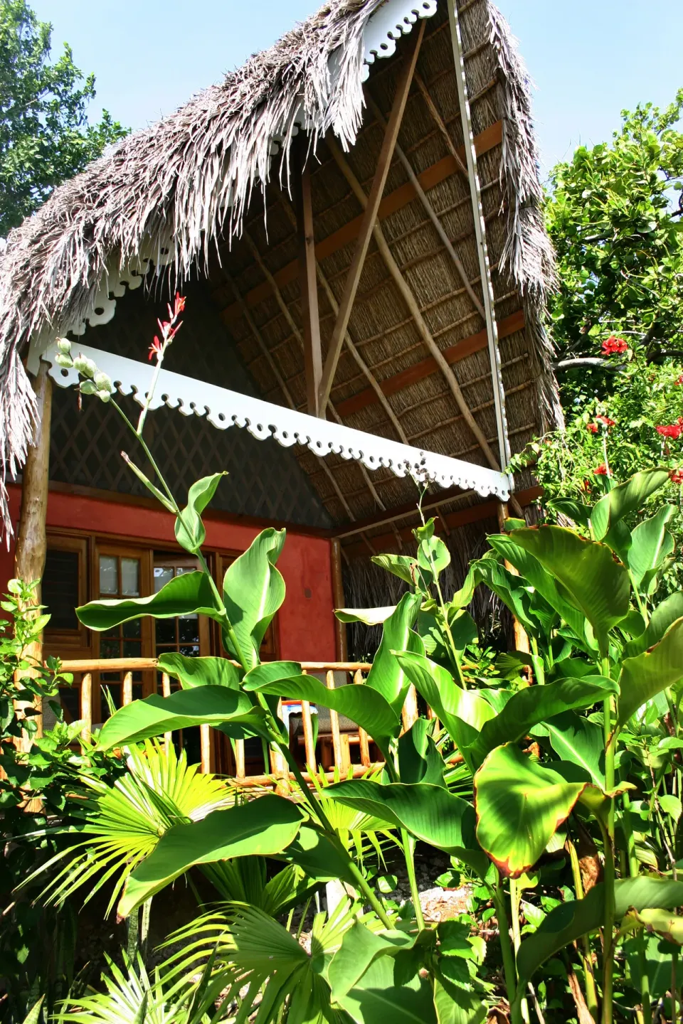 Superior Garden View thatched cottage exterior at Tensing Pen Hotel.