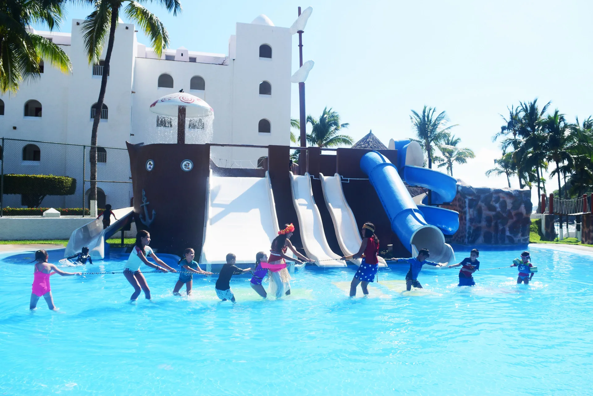 Children play near pirate-themed water slides at Tesoro Manzanillo.