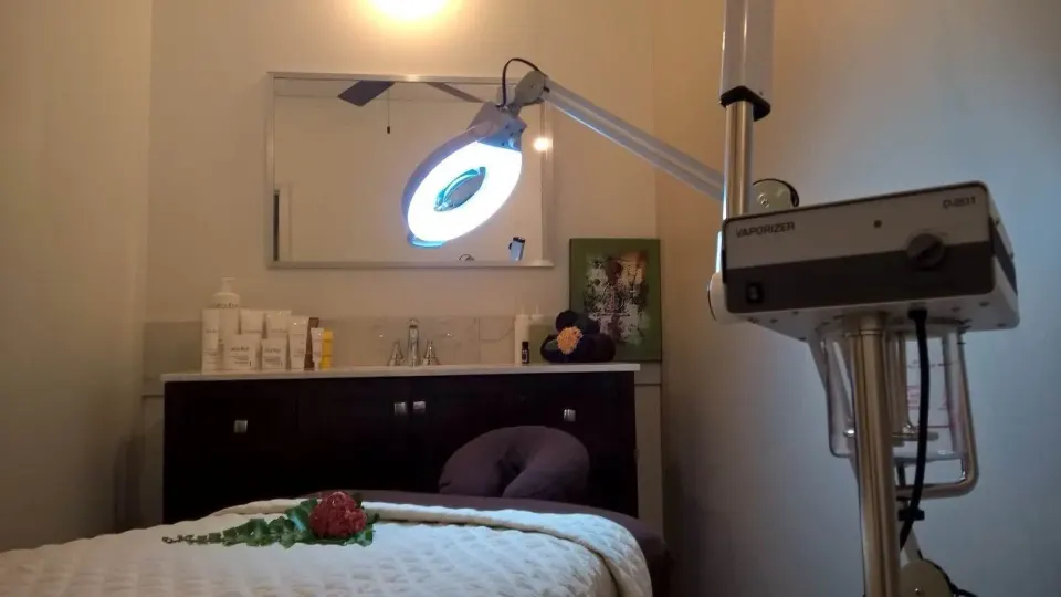 A spa treatment bed with facial equipment and counter space at The Atrium Resort.