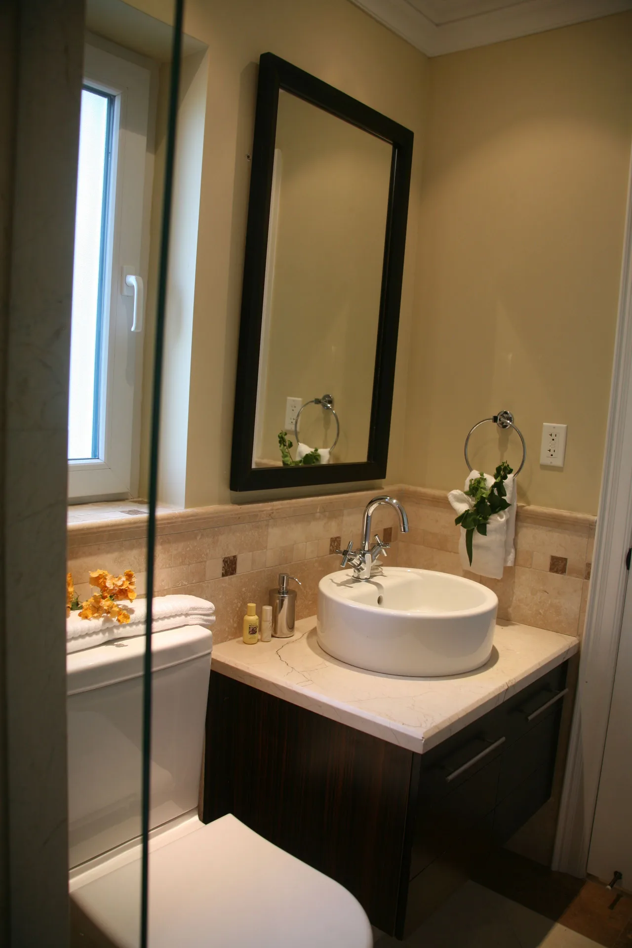 Two-bedroom condo bathroom with vessel sink and shower glass at The Atrium Resort.