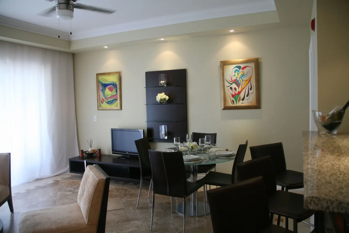 Open living and dining area in a two-bedroom condo at The Atrium Resort.