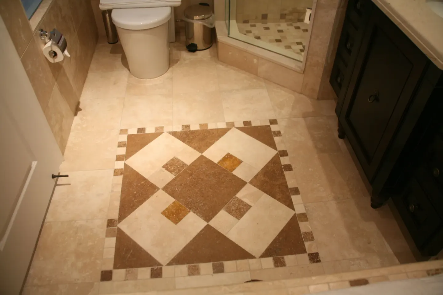 One-bedroom condo bathroom tile floor, toilet, shower, and vanity at The Atrium Resort.