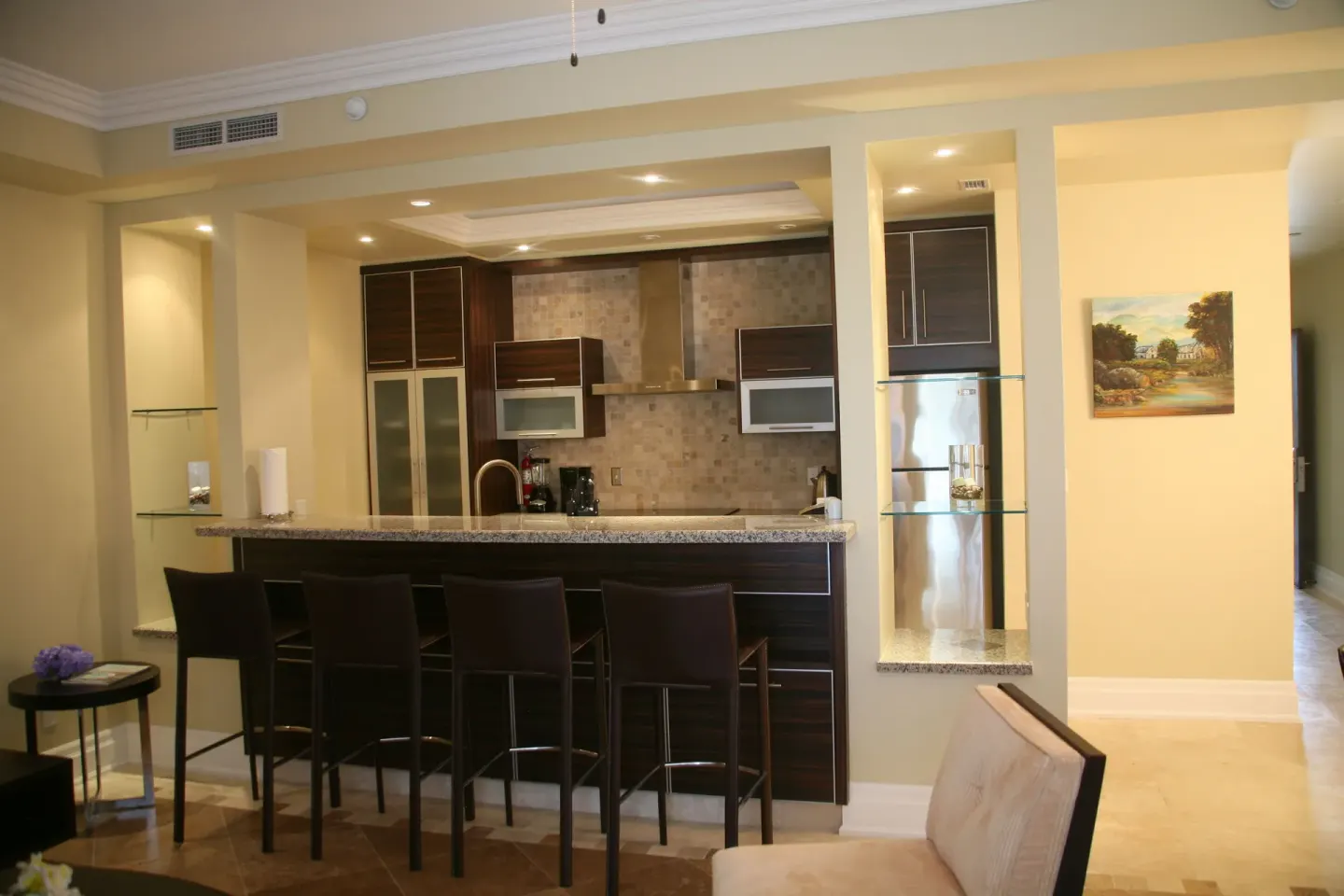 One Bedroom Condo kitchen bar with stools at The Atrium Resort.