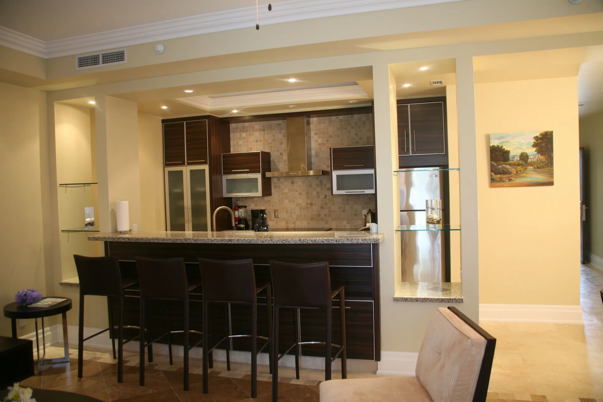 One Bedroom Condo kitchen bar with stools at The Atrium Resort.