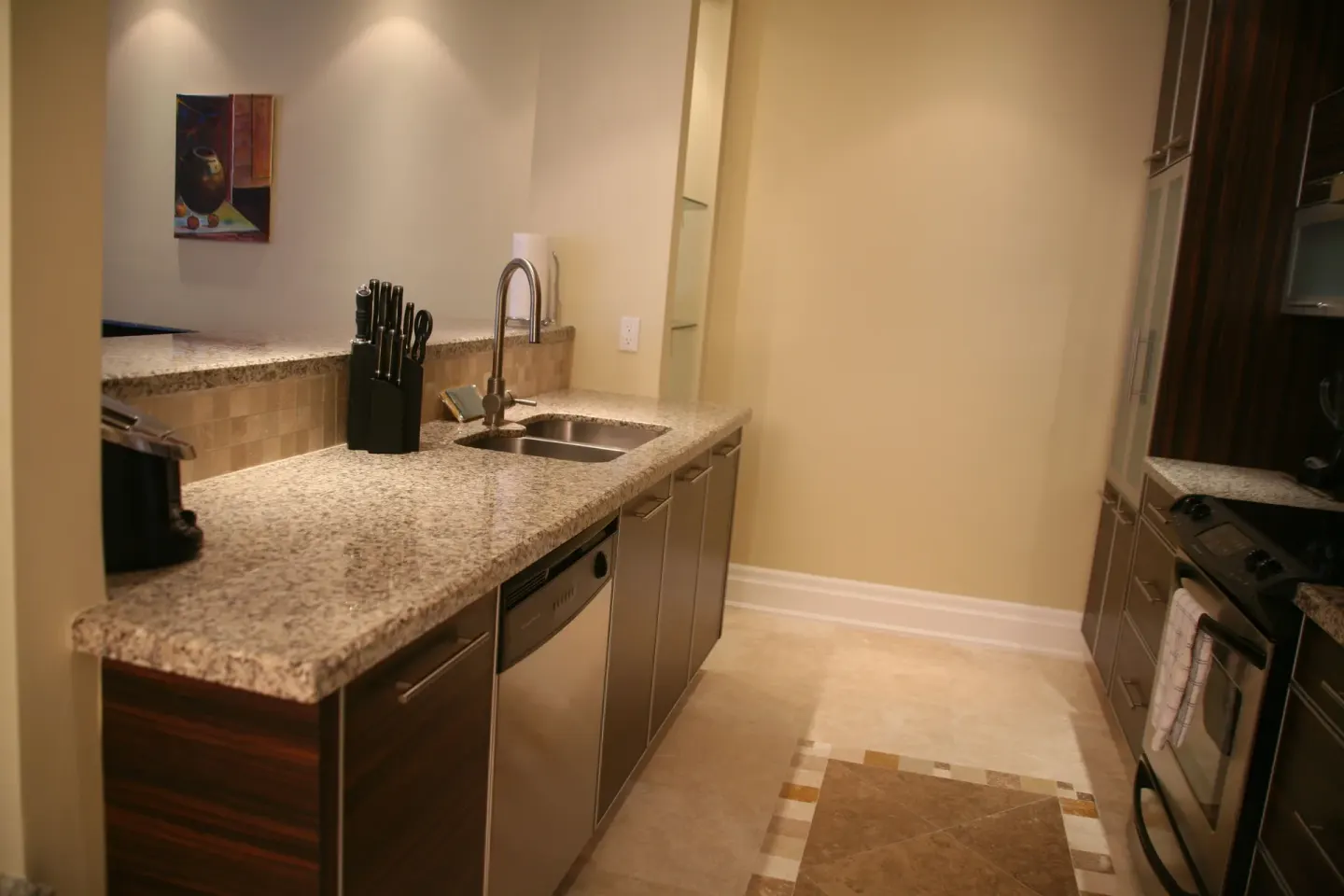 One Bedroom Condo kitchen counter and sink at The Atrium Resort.