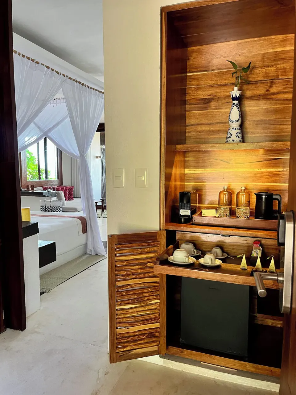 In-room beverage and hospitality cabinet in a junior suite at The Beach Tulum