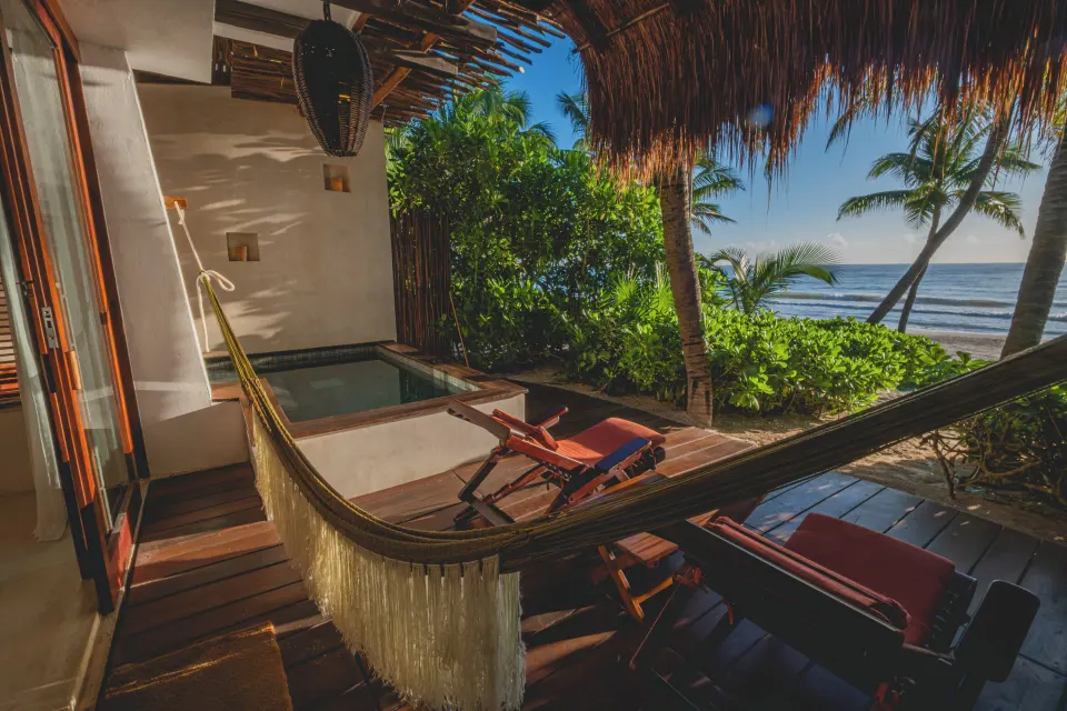 Private plunge pool, hammock and ocean view on a beachfront terrace at The Beach Tulum