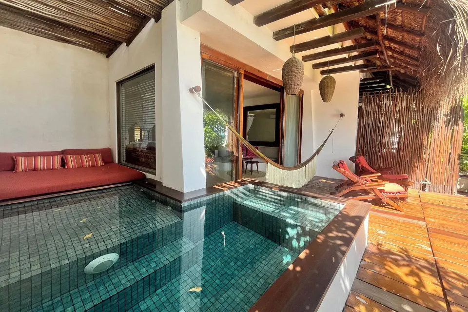 Private pool, sun loungers and a hammock on a Junior Suite deck at The Beach Tulum.