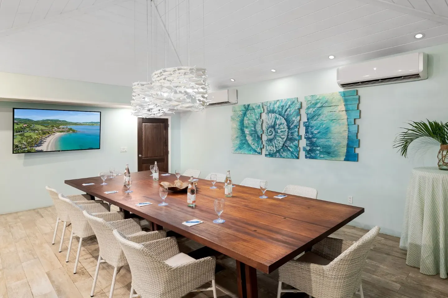Modern meeting room with coastal wall art at The Buccaneer Beach & Golf Resort.