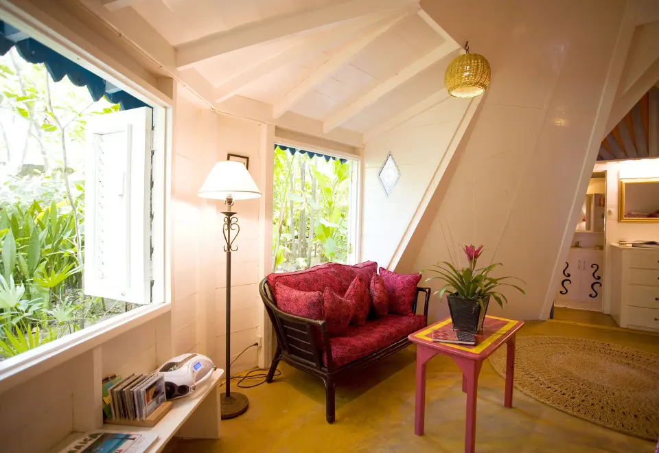 Deluxe cottage sitting area with garden windows at The Caves.