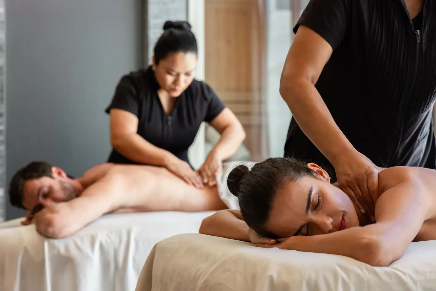 Two guests receive side-by-side massages at The Club at Solaz.