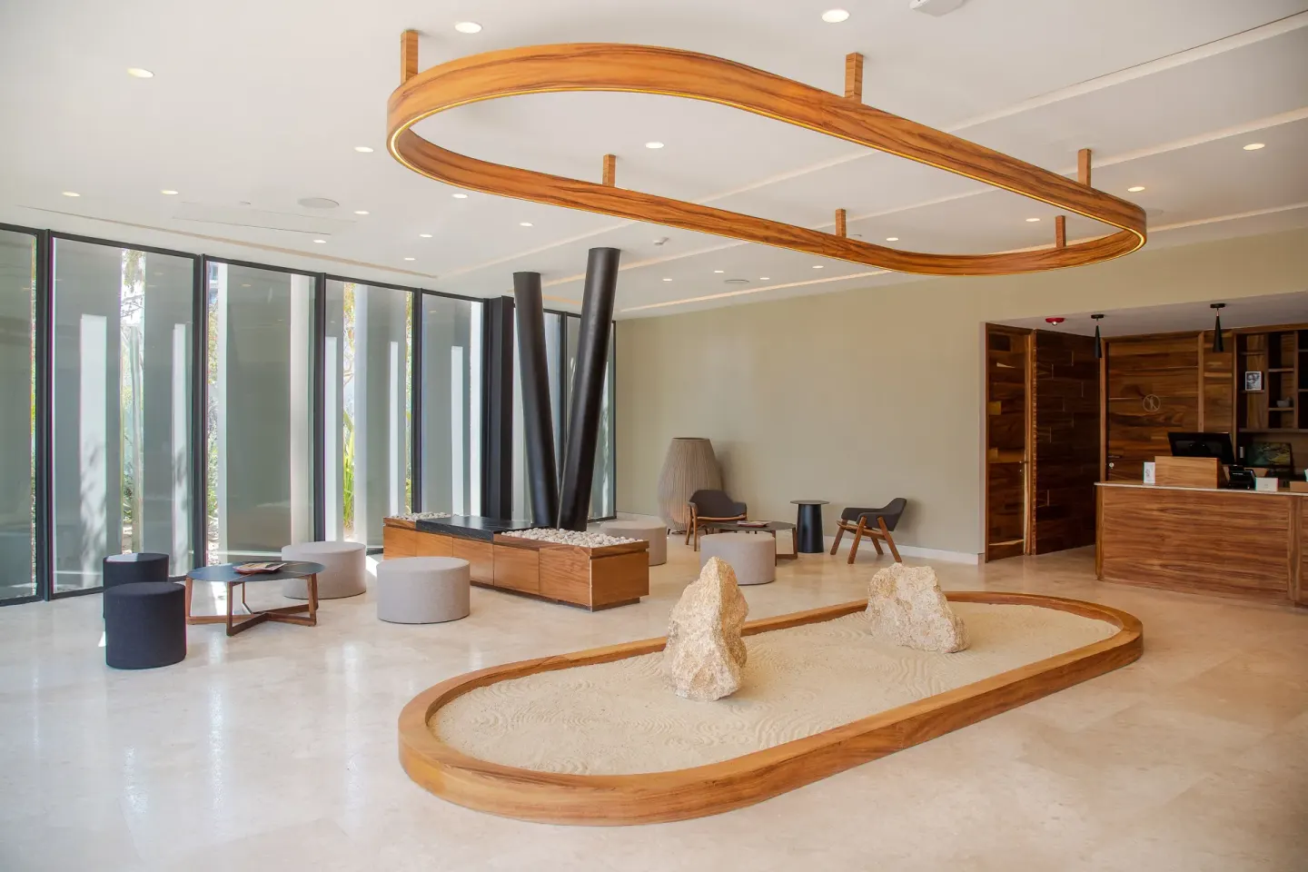 A bright lobby seating area with wood accents at The Club at Solaz.