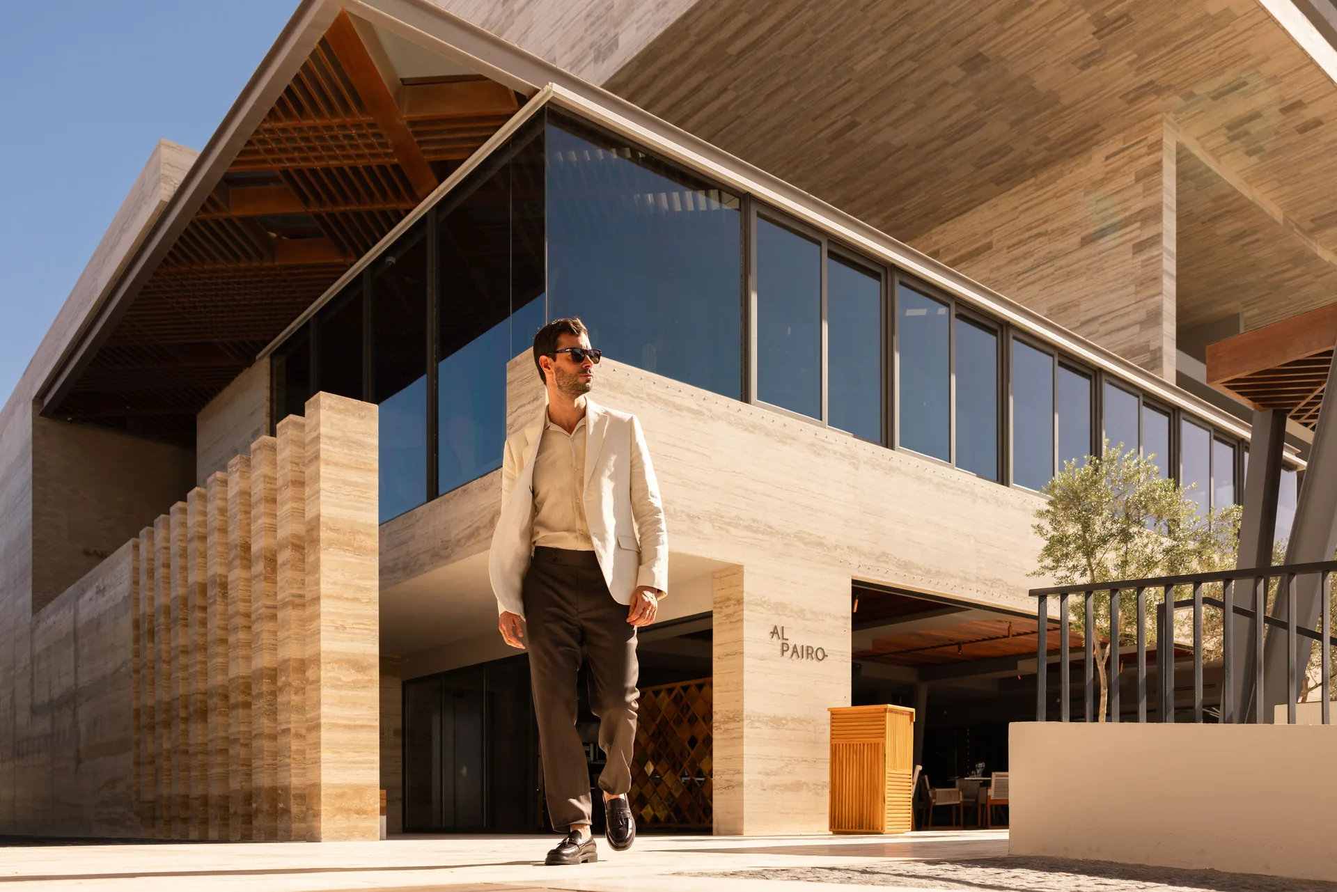 The Al Pairo entrance and modern exterior are shown at The Club at Solaz.