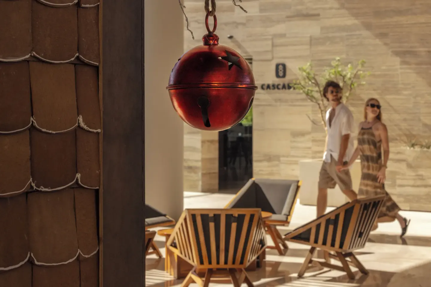 A red hanging bell decorates a shaded lounge near Cascabel at The Club at Solaz.