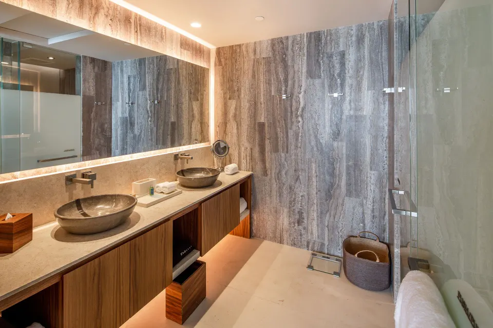 Bathroom vanity in a One Bedroom Villa Ocean View at The Club at Solaz with twin vessel sinks.