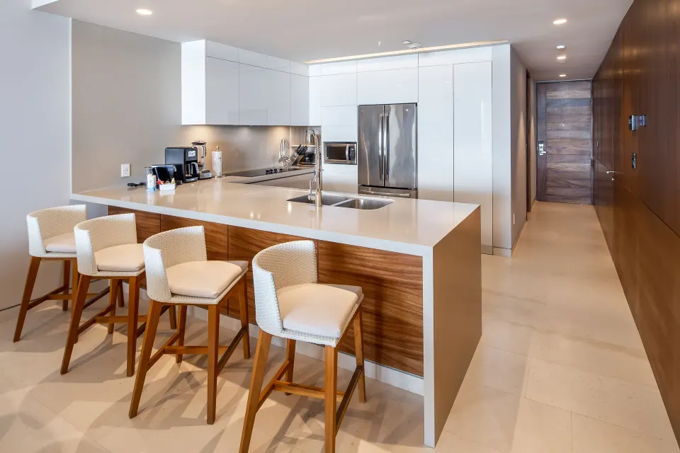 Kitchen island and bar stools in a One Bedroom Villa Ocean View at The Club at Solaz.