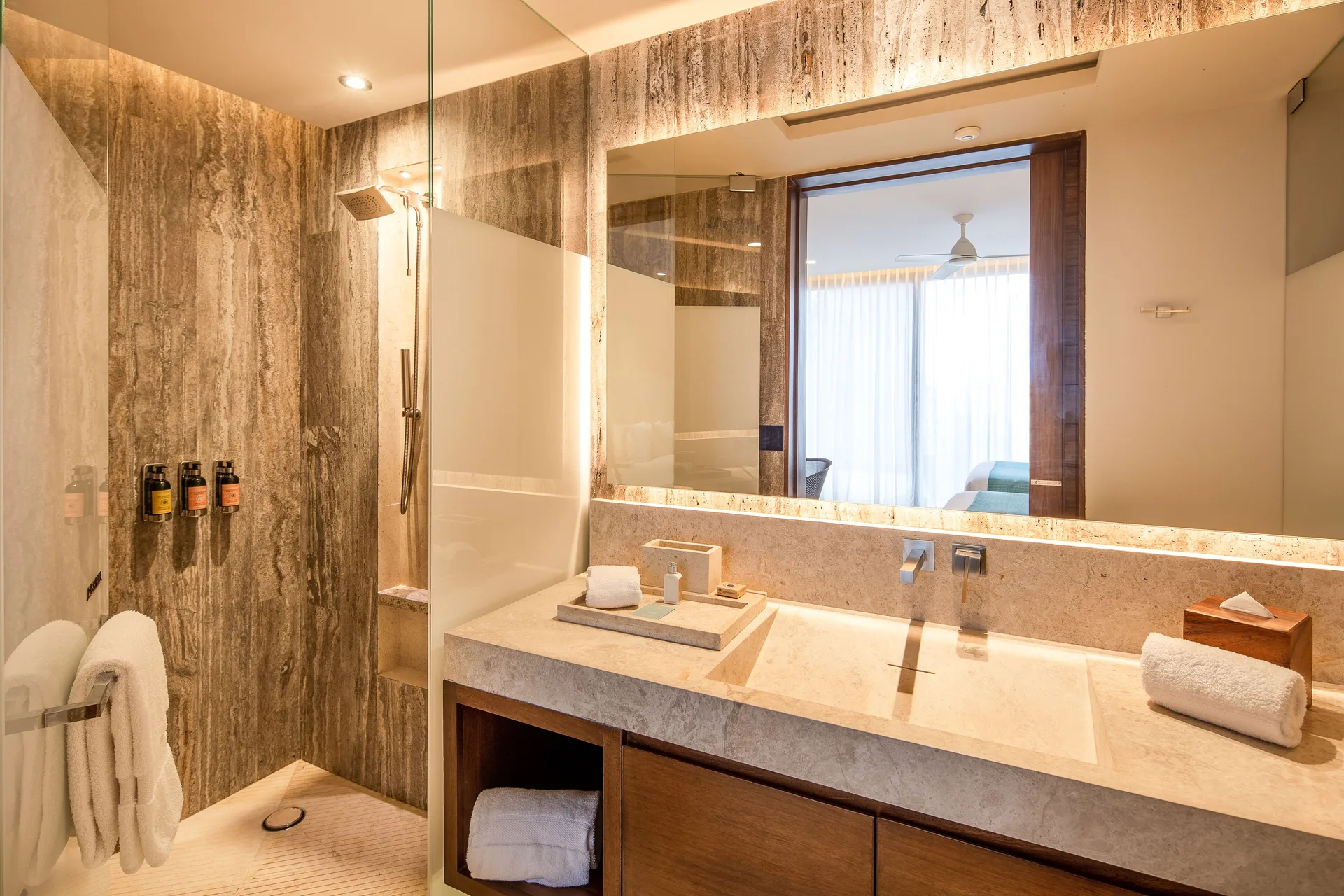 Villa bathroom with shower, vanity, and mirror at The Club at Solaz.