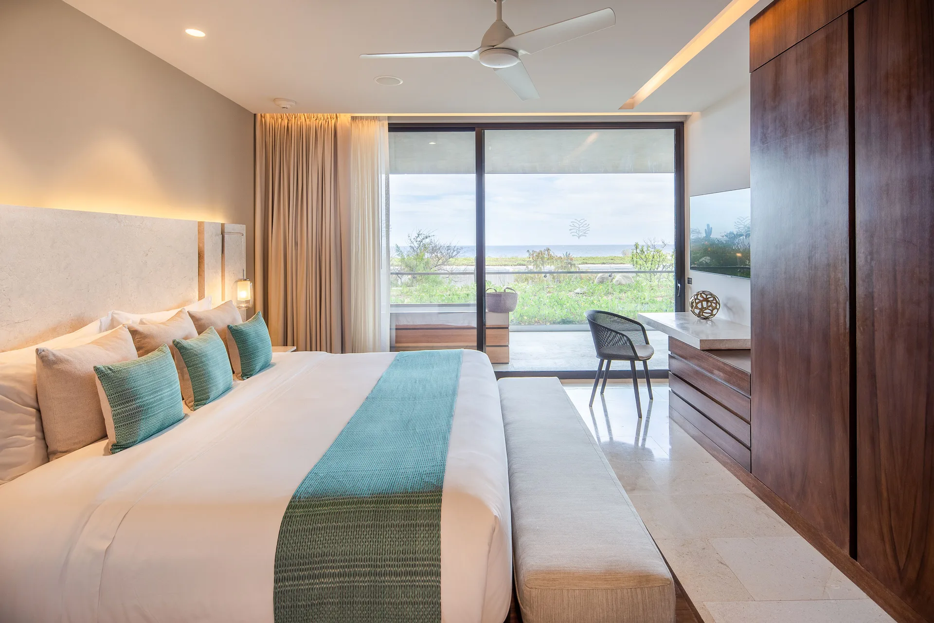 King bedroom with balcony and ocean view in a villa at The Club at Solaz.