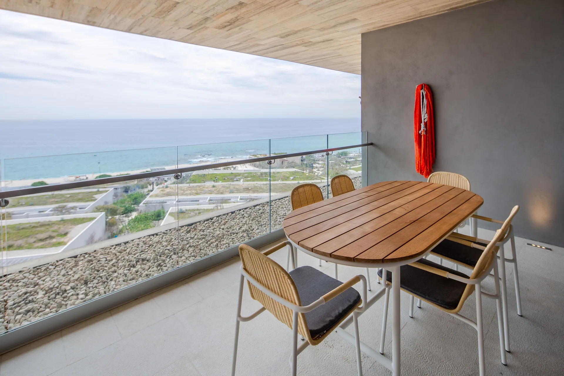 Two Bedroom Villa Ocean View balcony with dining table at The Club at Solaz.
