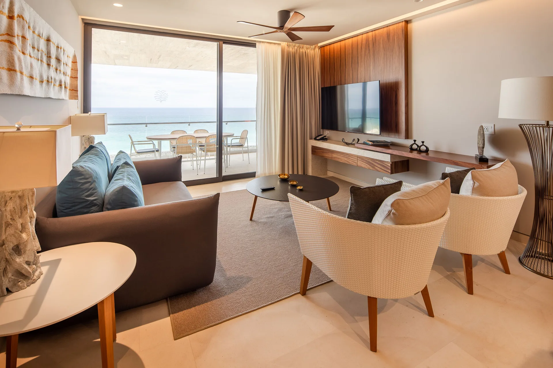 Two Bedroom Villa Ocean View living room with balcony at The Club at Solaz.