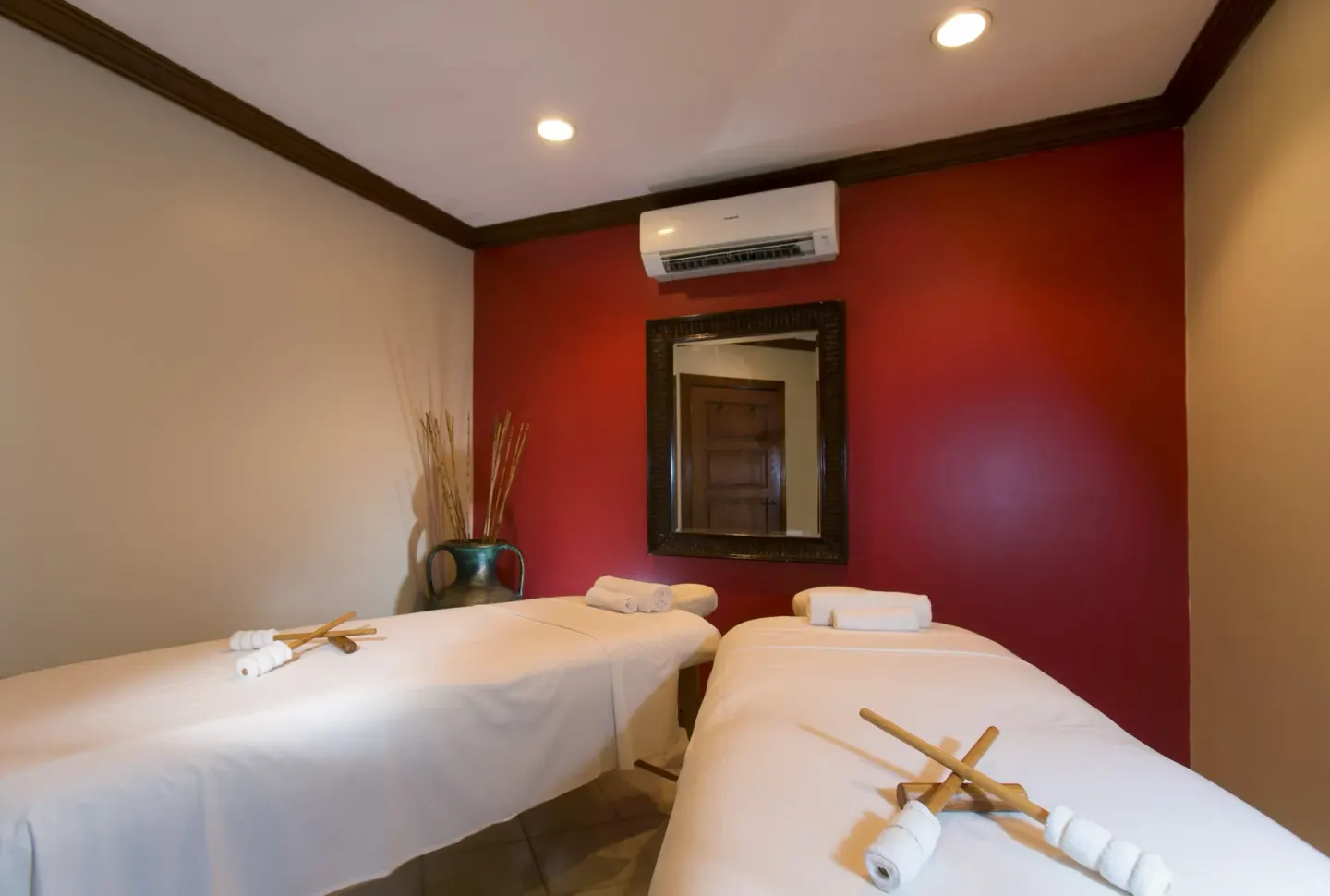 Spa treatment room with two massage tables at The Club, Barbados Resort & Spa.