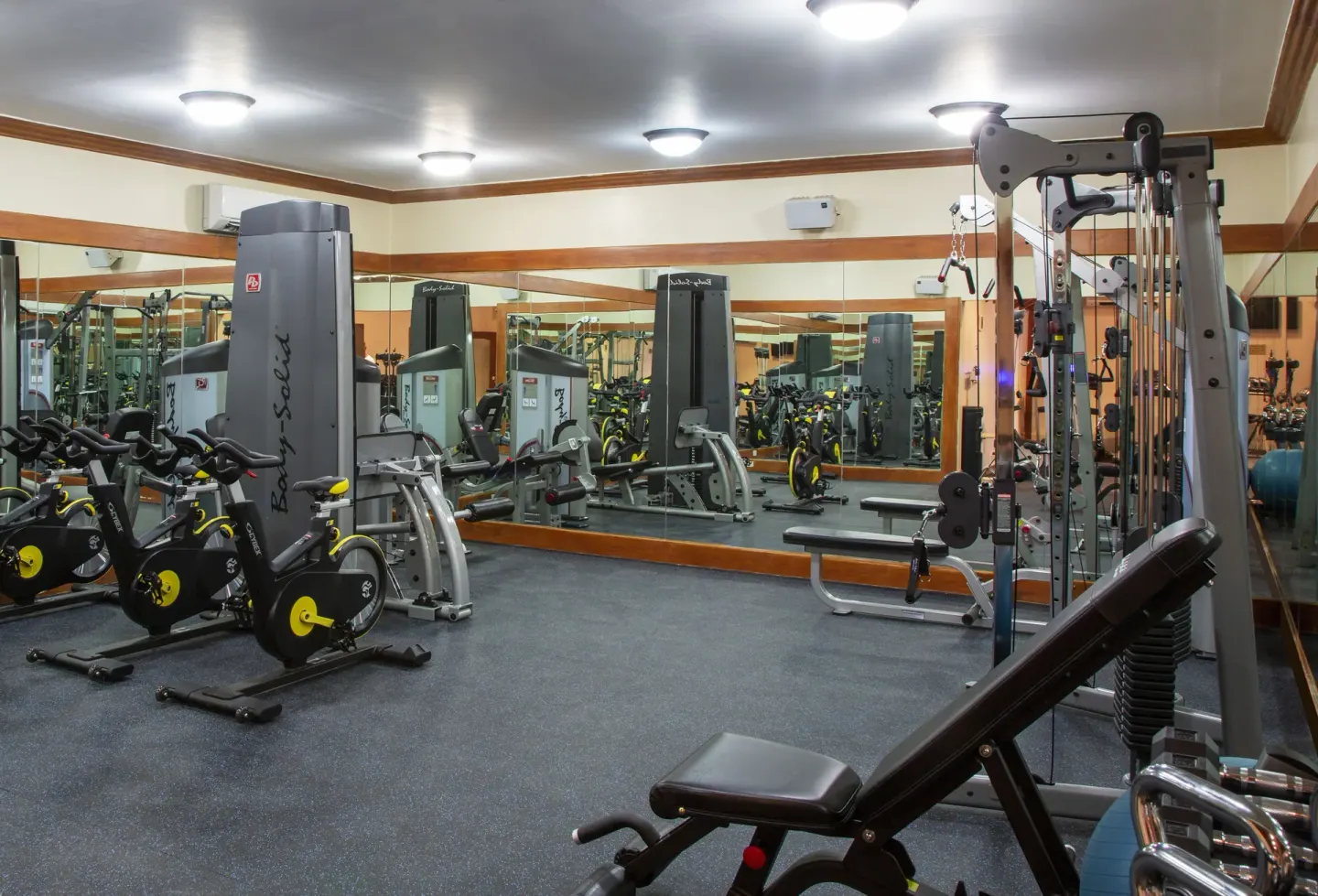 Fitness room with cardio and weight machines at The Club, Barbados Resort & Spa.