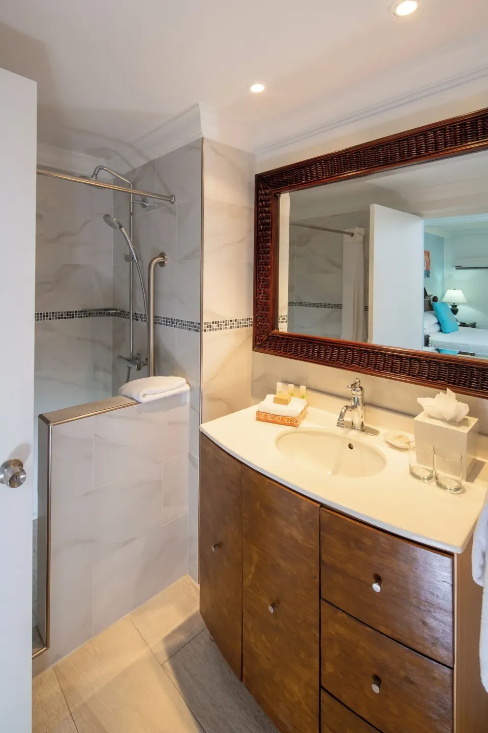 Garden View room bathroom vanity and walk-in shower at The Club, Barbados Resort & Spa.