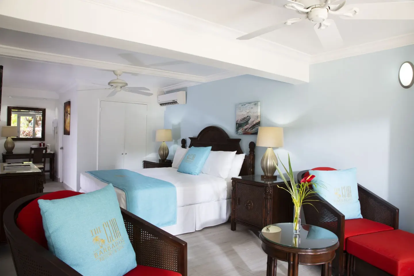 Garden View guest room seating area and king bed at The Club, Barbados Resort & Spa.