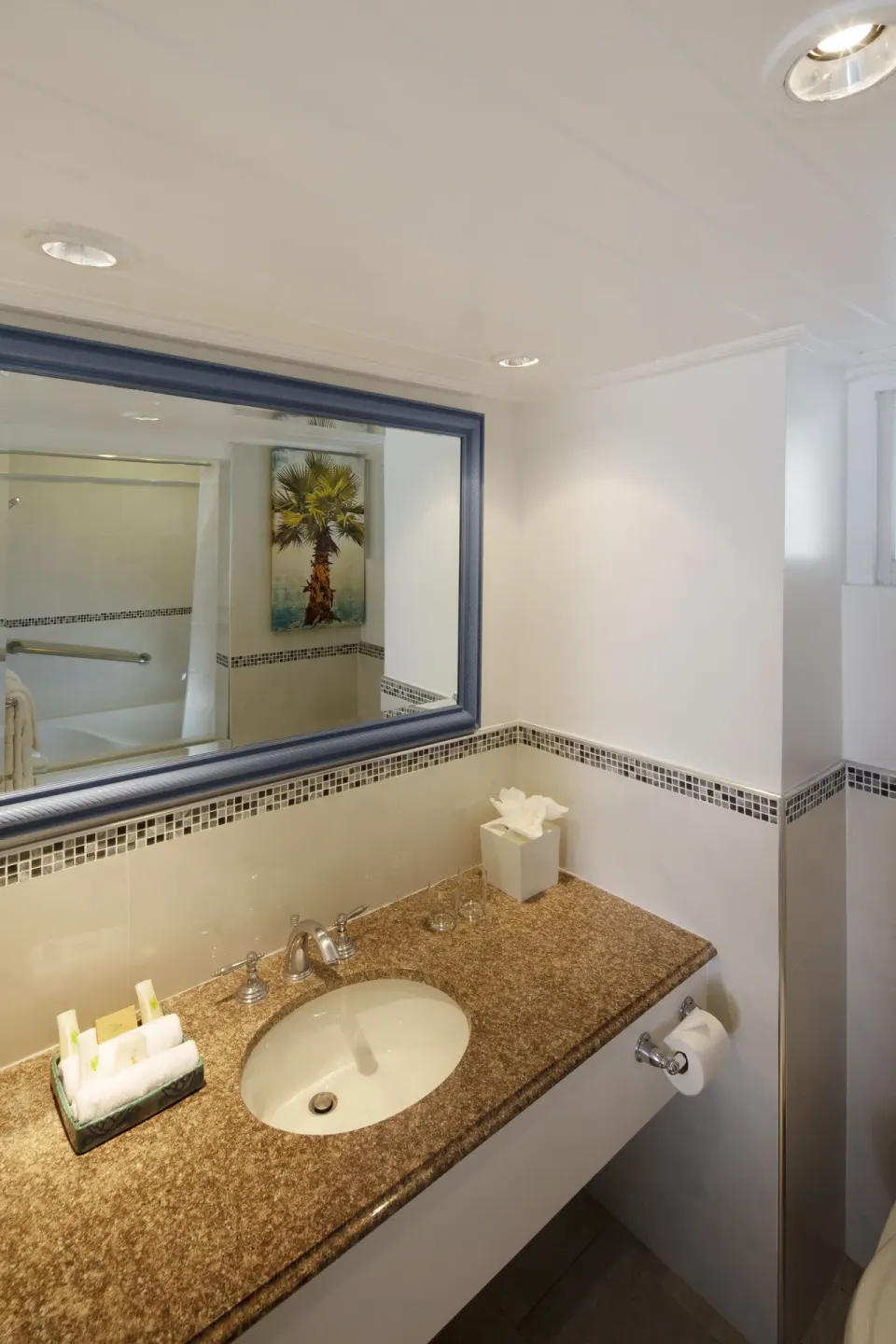One Bedroom Oceanfront Suite bathroom vanity and mirror at The Club, Barbados Resort & Spa.