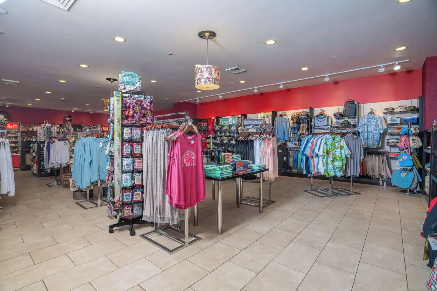Retail shop interior at The Condado Plaza Hotel with clothing, bags, and souvenir displays.