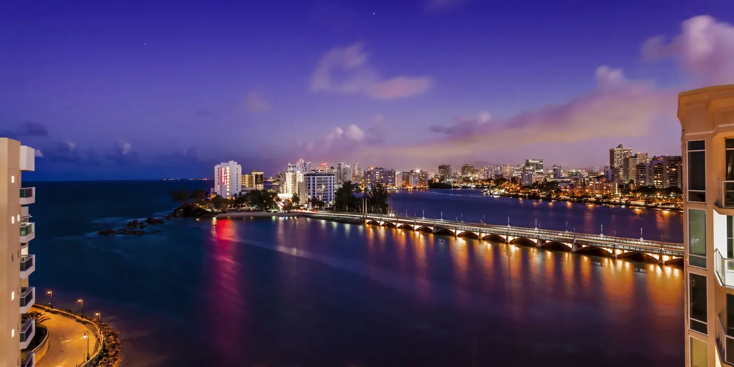Twilight lagoon and city skyline view from The Condado Plaza Hotel.
