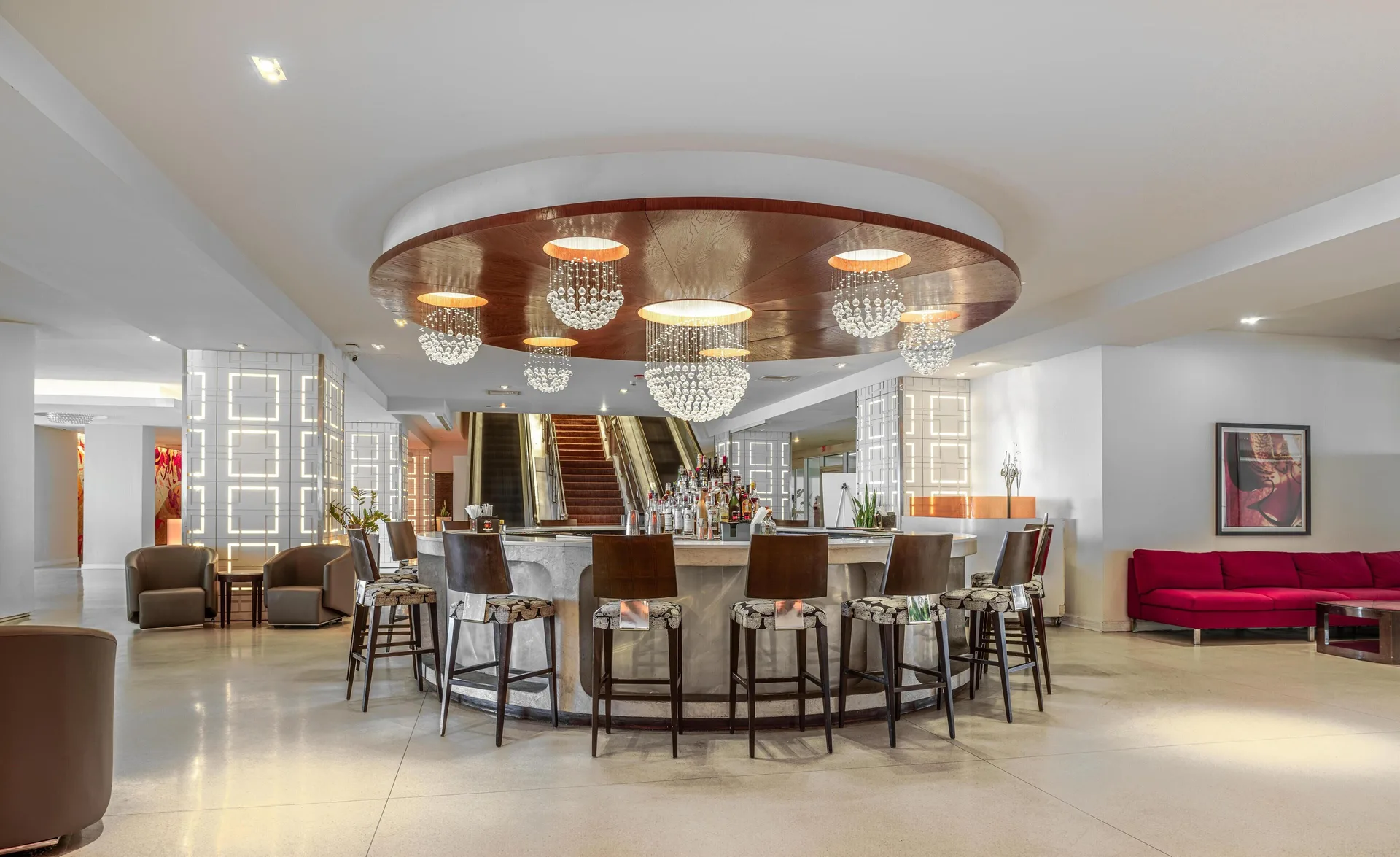 Lobby cocktail bar with chandelier lighting at The Condado Plaza Hotel.