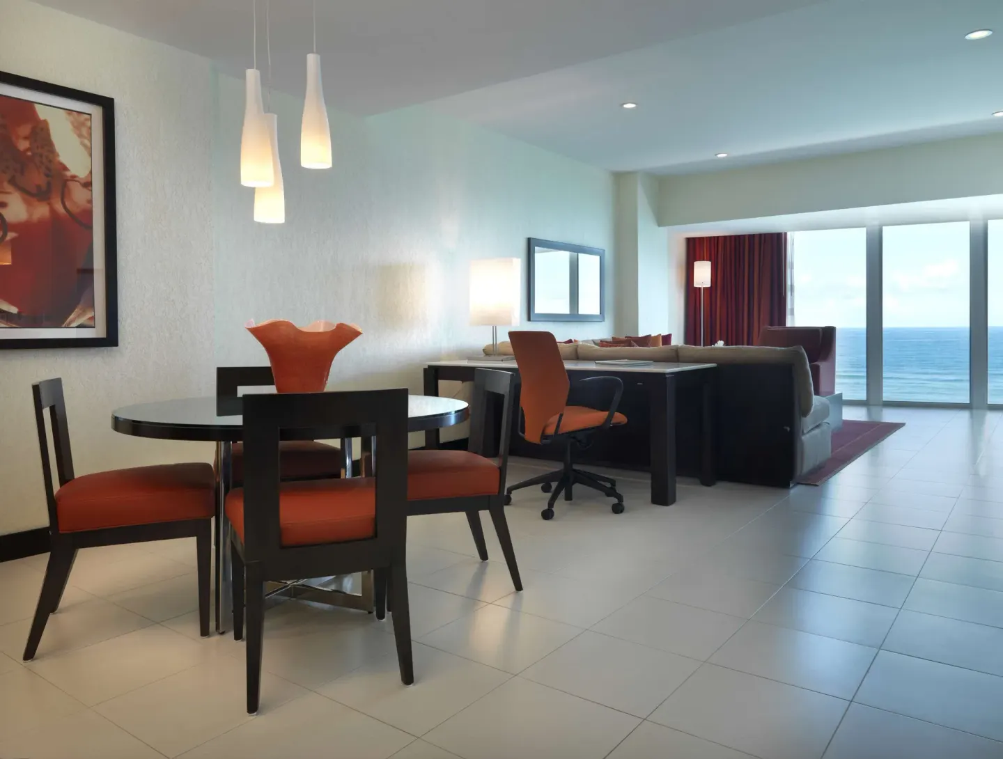 Oceanfront Deluxe Suite living and dining space at The Condado Plaza Hotel.