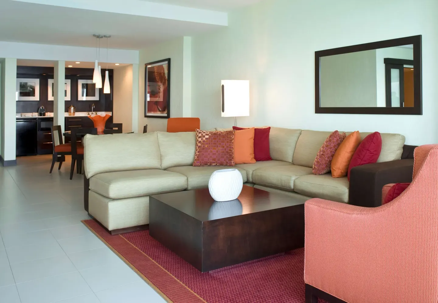 Oceanfront Deluxe Suite living room with sectional sofa at The Condado Plaza Hotel.