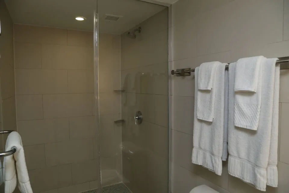 Junior Suite balcony bathroom shower and towels at The Condado Plaza Hotel.