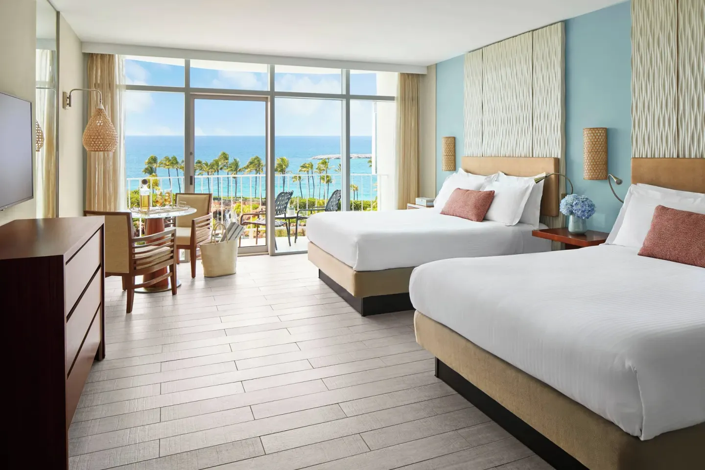Double queen guest room with balcony and ocean view at The Coral at Atlantis.