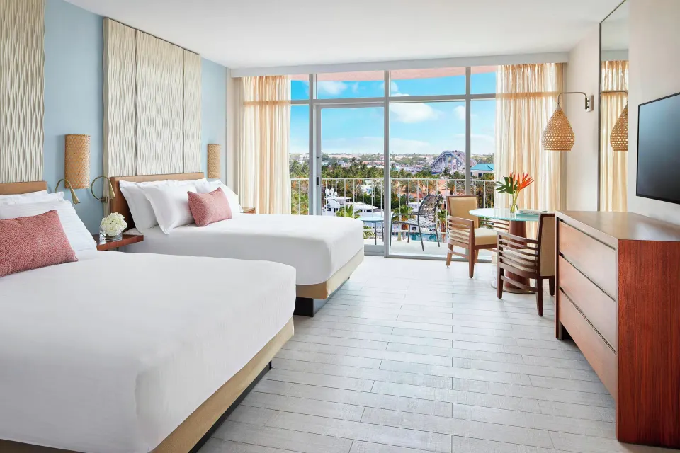 Double queen guest room with balcony and resort view at The Coral at Atlantis.
