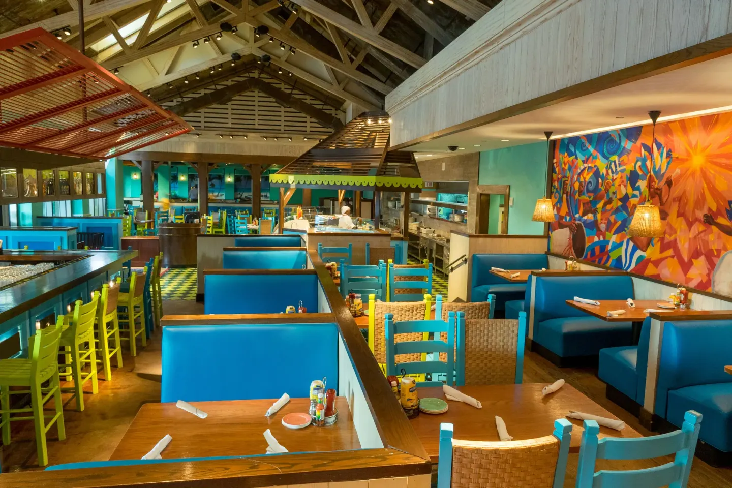 A colorful Caribbean-style restaurant dining room at The Coral at Atlantis.